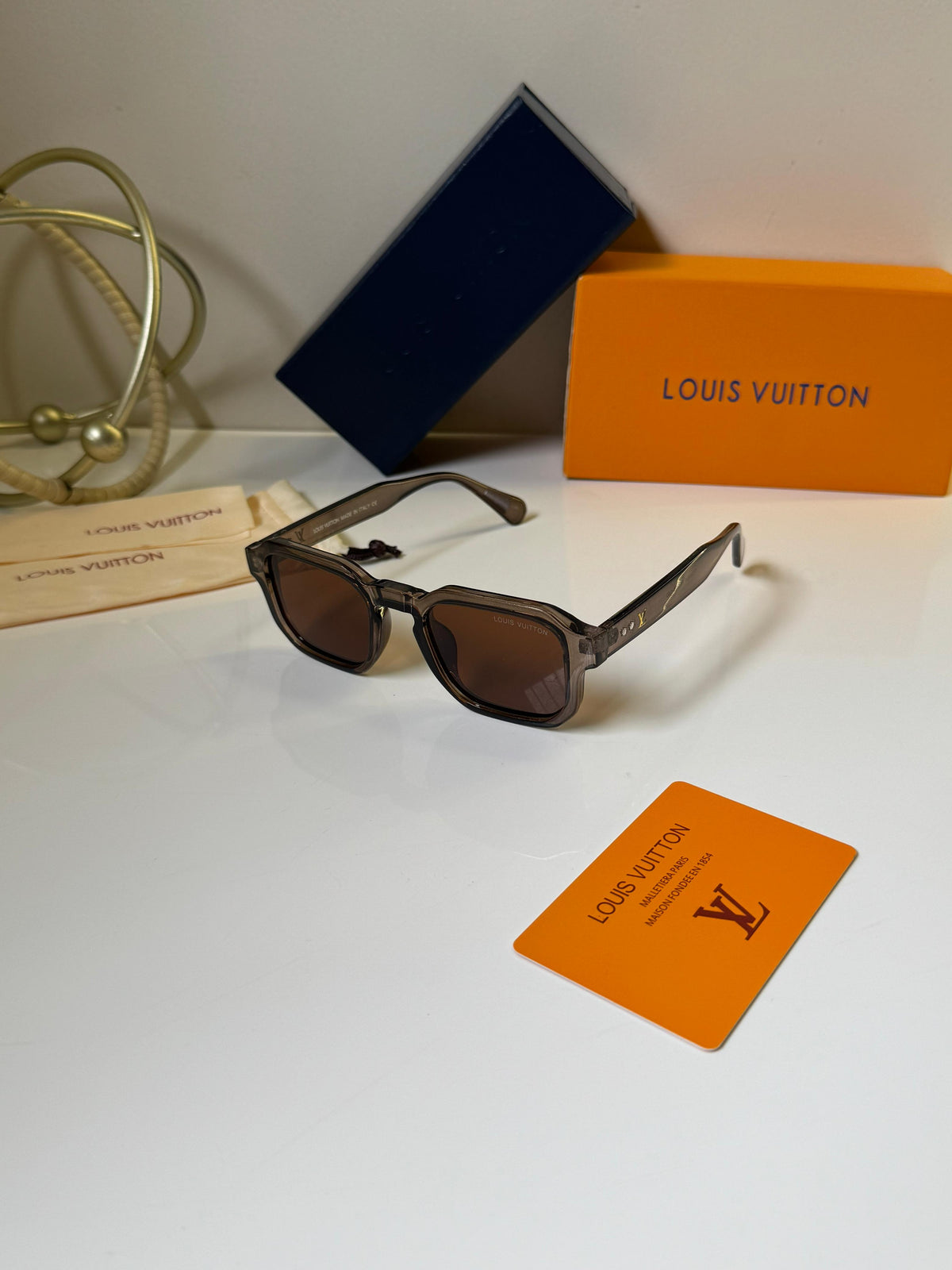 Louis Vuitton square translucent grey frames and warm brown-tinted lenses Women sunglasses