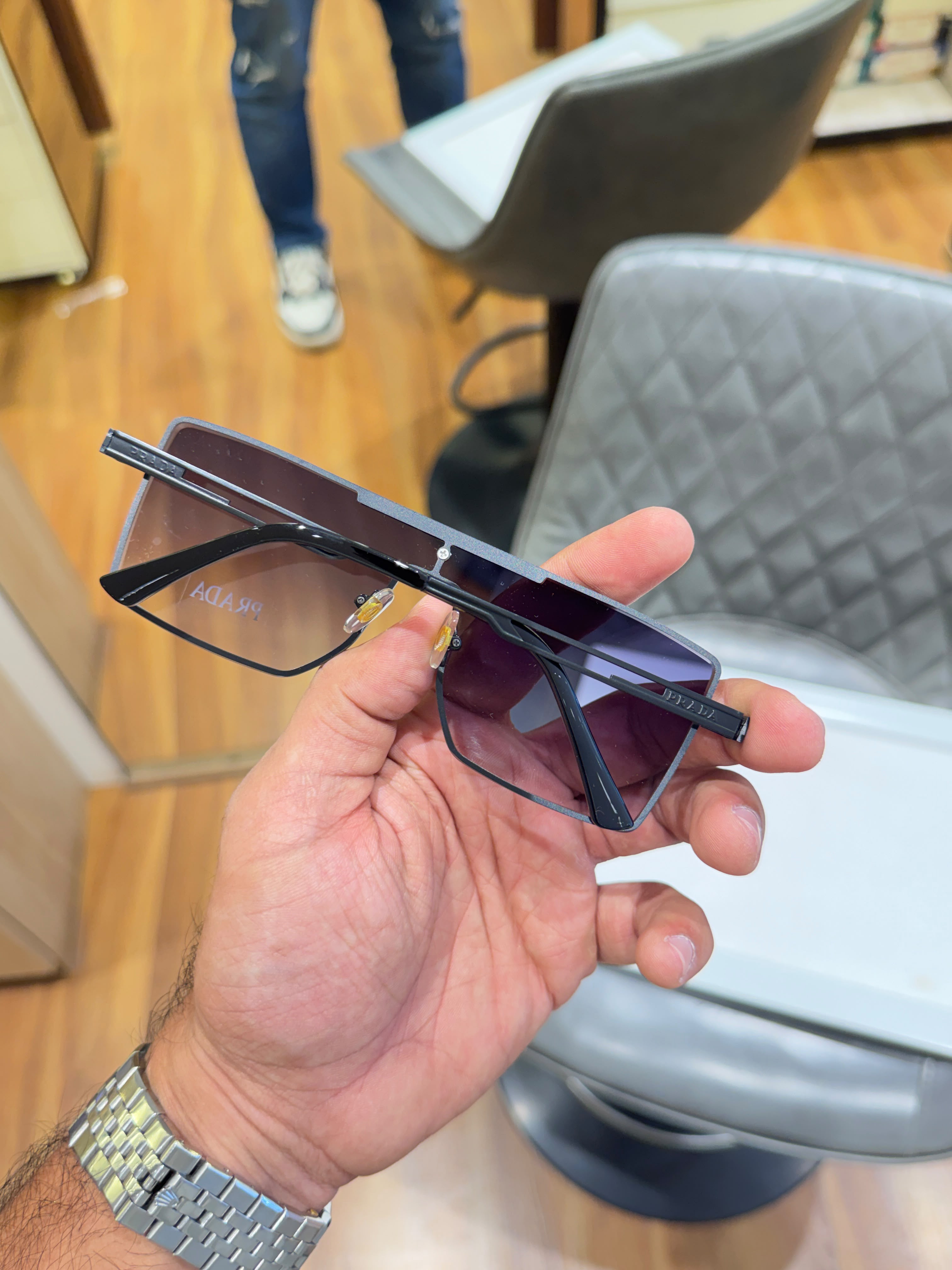 Prada semi-rimless featuring dark gradient lenses Women sunglasses